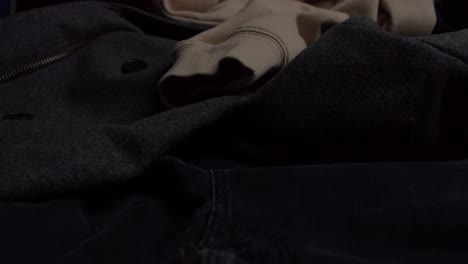 mens warm clothes left on bed