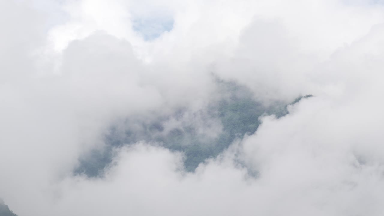 Cloudy skyline thick layer high altitude valley low visibility cloud Cumulonimbus