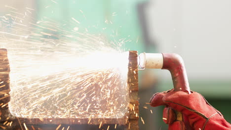 Sparks-Flying-From-Blow-Torch-Used-In-Cutting-Metal---close-up