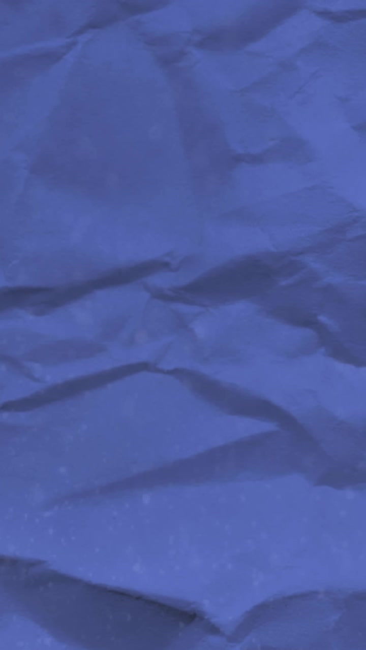 School concept icons against blue crumpled paper in background