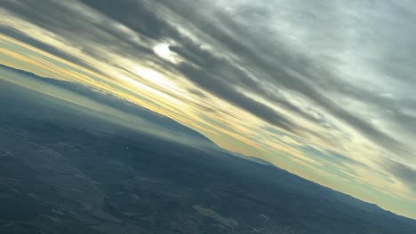 dramatic snowy mountain landscape at sunrise in sierra nevada, granada, spain: aerial view of majestic peak mulacen and hazy valleys