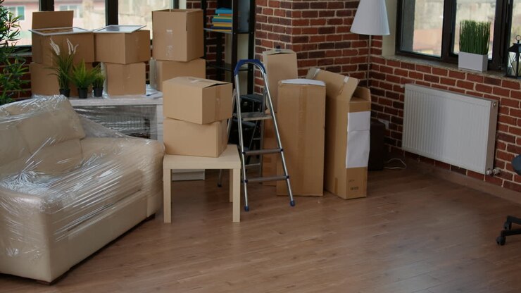 African american couple carrying furniture to decorate new home