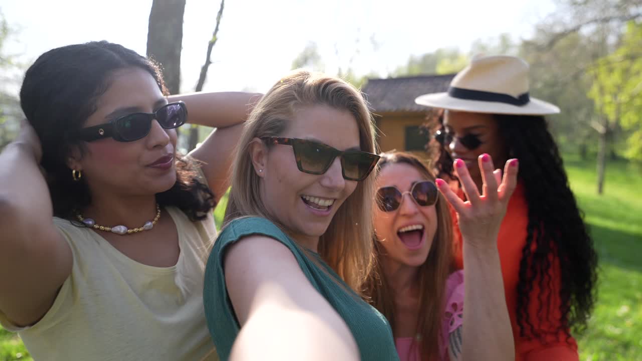 Group of women taking a selfie outdoors