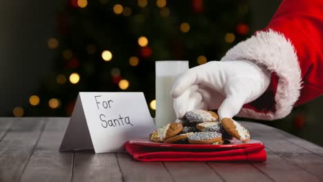 Santa-eating-cookies-and-milk-by-Christmas-tree-lights
