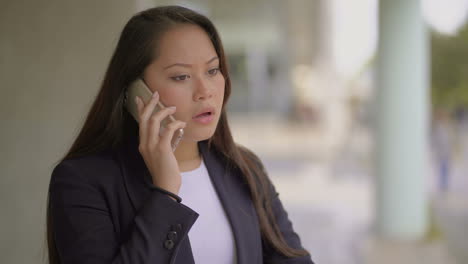 Upset-woman-talking-by-mobile-phone