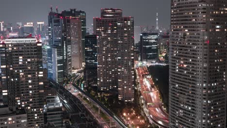 city view and traffic from seaside top observatory of world trade center at night in minato, tokyo, japan