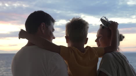 child with toy plane and parents outdoor