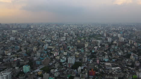 vast panoramic aerial view of an urban city, establishing drone descending shot