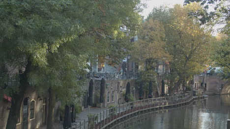 view of canals and closed restaurants at docks in utrecht city, the netherlands