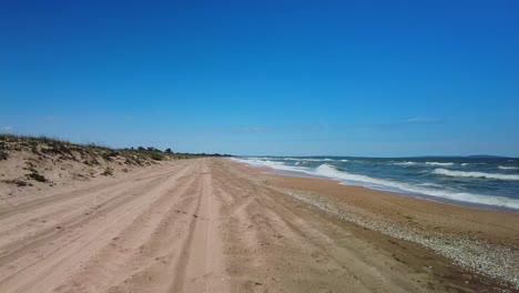 endless empty beach of the sea of azov against the blue sky