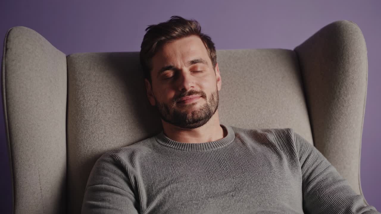 Man resting in an armchair