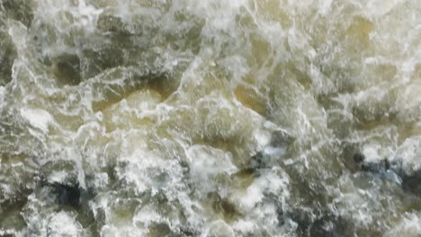 Powerful-waterfall-crashing-down-rocks-in-Owen-Sound,-Canada,-creating-white-foamy-rapids