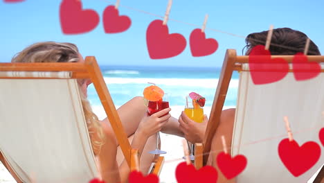 happy couple toasting on beach