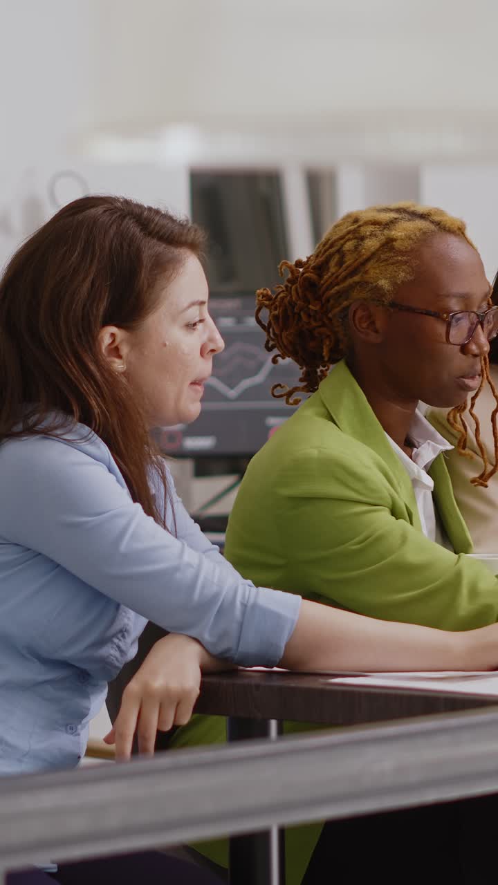 Vertical video: Multiethnic people presenting analytics report in office