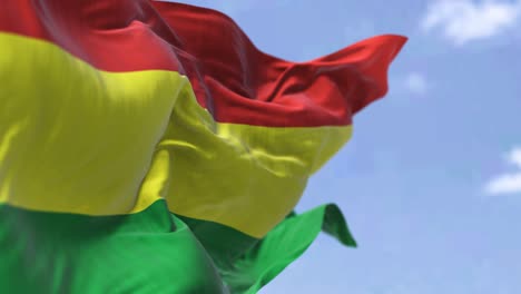 detail of the national flag of bolivia waving in the wind on a clear day