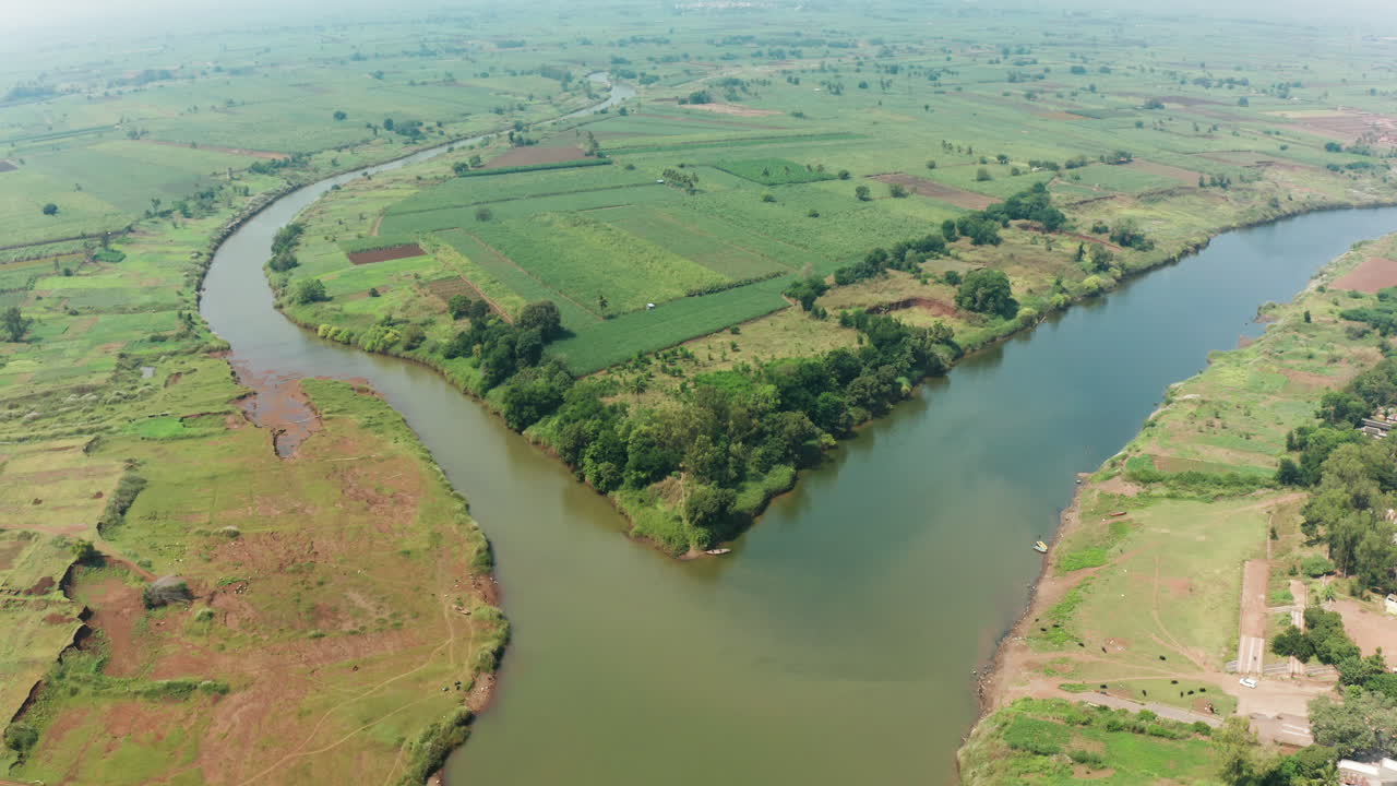 Beautiful confluence of Krishna and Warana rivers, where flowing waters meet amidst serene landscapes and vibrant greenery