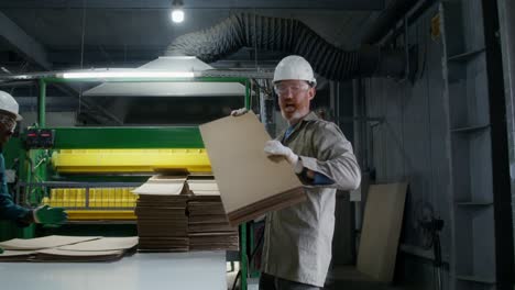 cardboard recycling plant workers