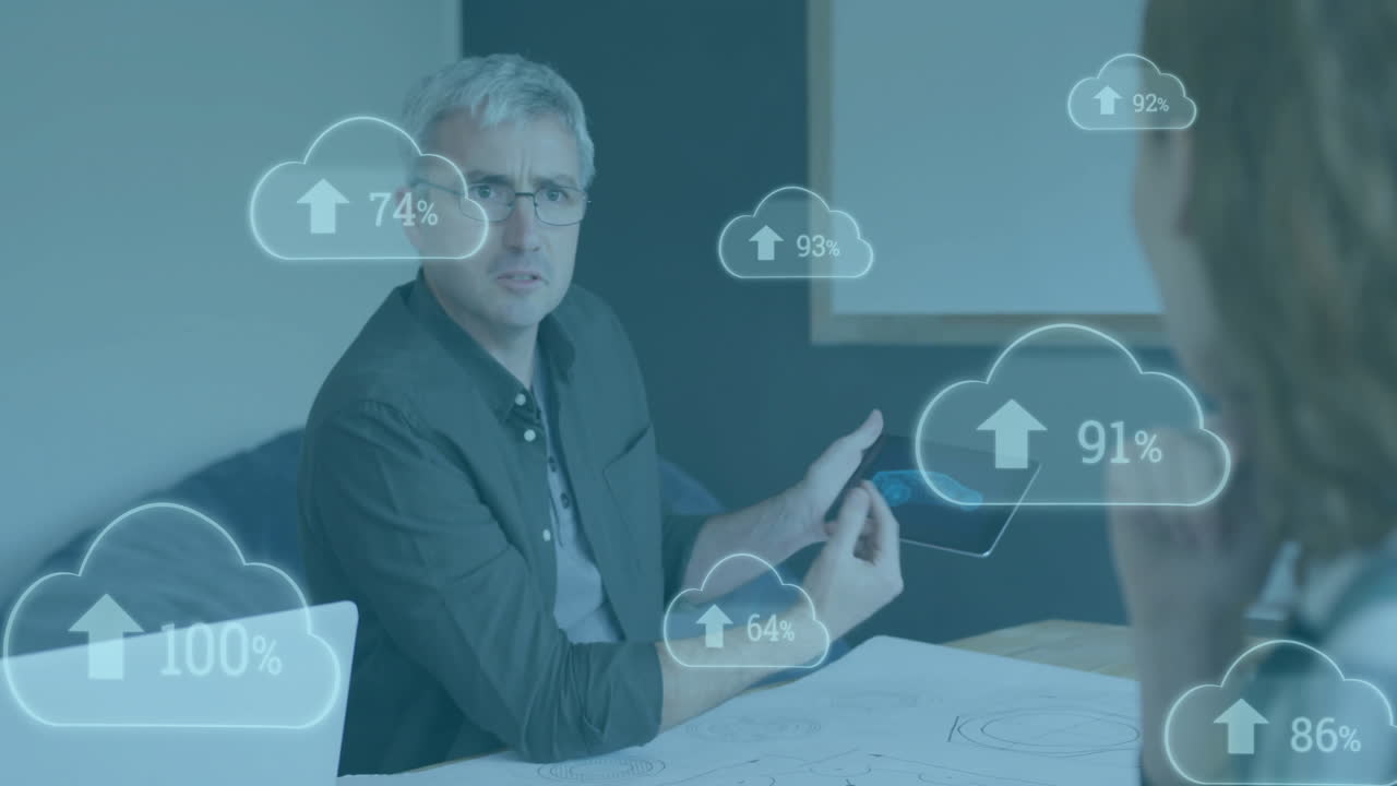 Animation of clouds with percent growing over caucasian businessman using tablet