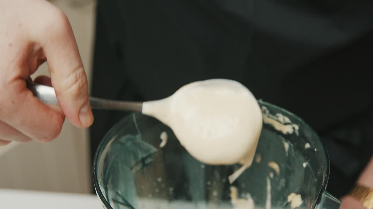 Freshly made Japanese Mayonnaise spooned out of the blender ready to taste