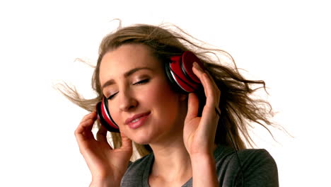 pretty blonde listening to music with eyes closed