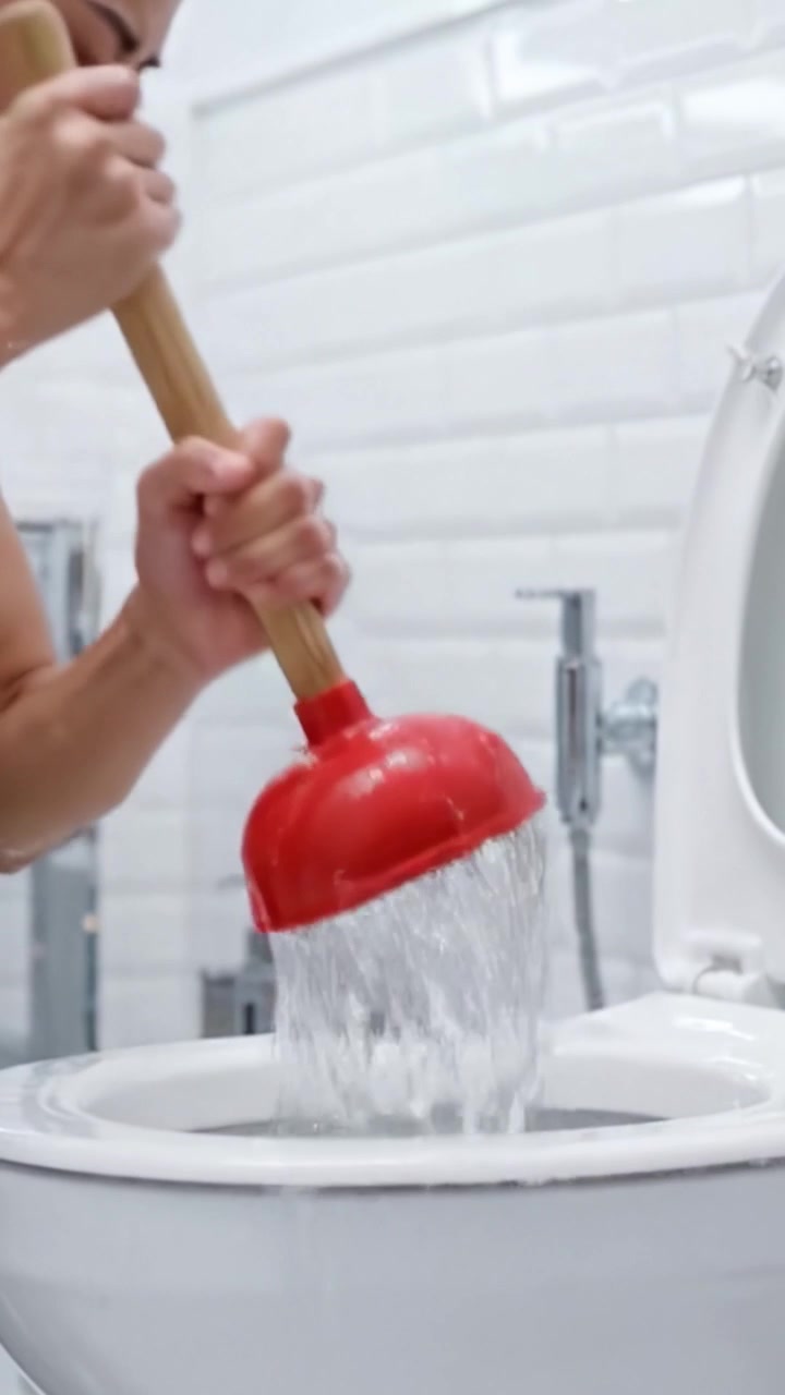 Fixing a Clogged Toilet: A Step-by-Step Process of Using a Plunger to Unclog and Clean Your Bathroom Fixture Efficiently and Effectively
