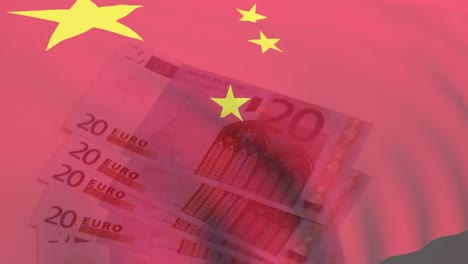 animation d'un drapeau chinois agité contre des billets en euros sur une surface blanche