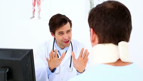 Doctor-speaking-to-patient-with-a-neck-injury