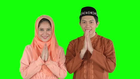 attractive muslim couple show greeting hands