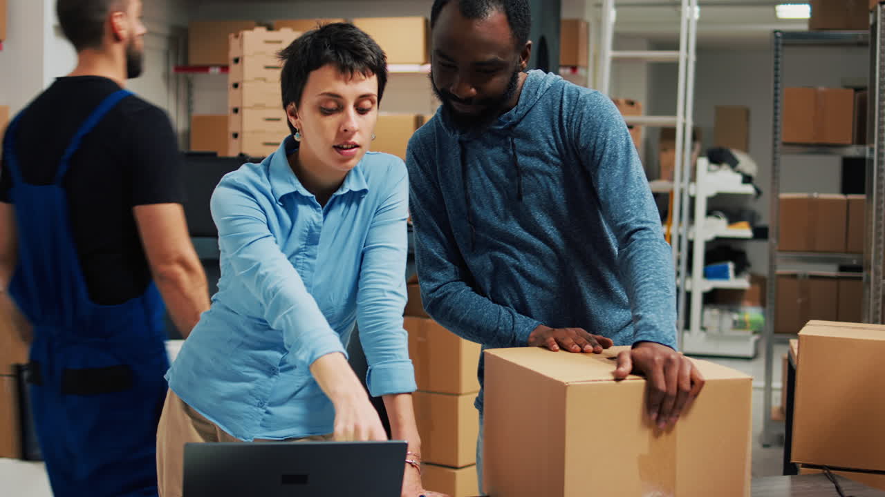 Warehouse employees packing boxes