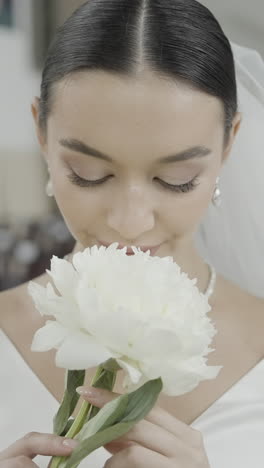 bride holding a peony