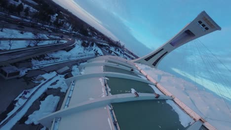 aerial view of montreal olympic stadium in winter at sunset