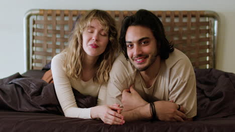 couple posing on bed