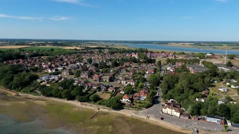 cinematic drone footage over shotley marina and surrounding seaside village near felixstowe, harwich, and the suffolk coastline, england
