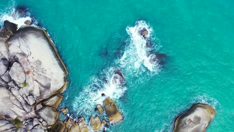 beautiful rocky coast and rough sea waves crashing on the stones