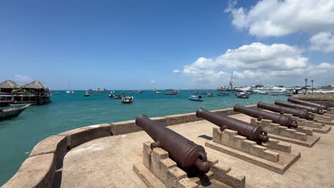 stone town harbor view with old cannons. zanzibar, tanzania.