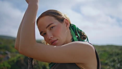 stylish model posing nature in sunlight closeup. confident woman traveling solo