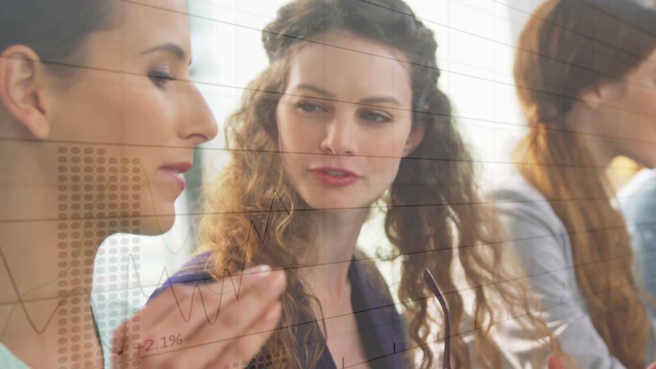 Center woman turning to left woman, starting data talk, graphs overlaying, third woman staying idle