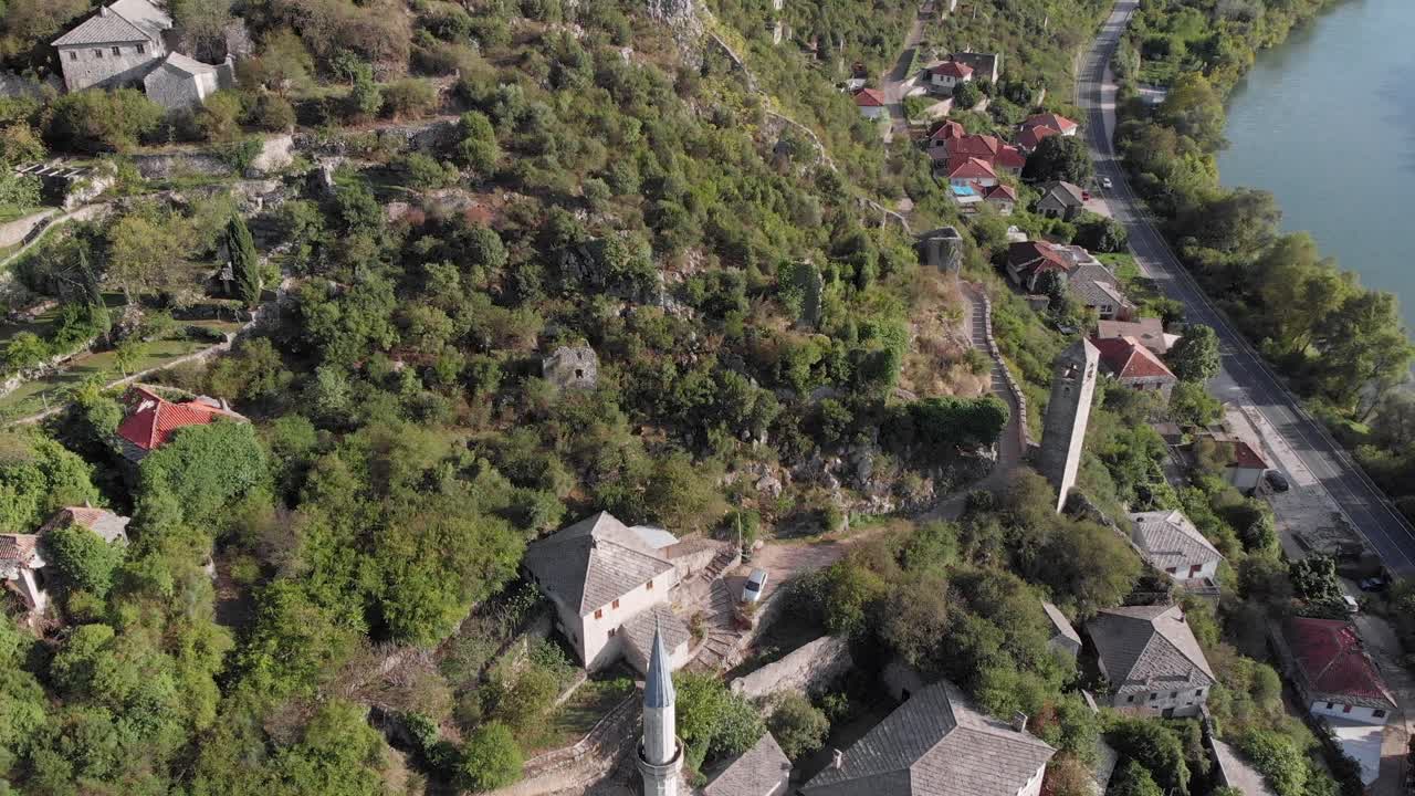 Aerial View of a Historic Town on a Hillside by a River