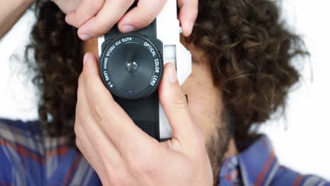 photographer taking photo with vintage camera