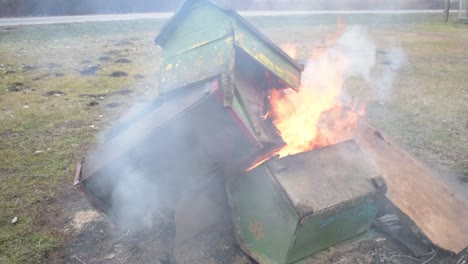 pile of dog houses on fire