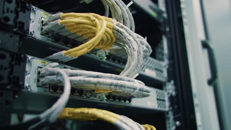 exploring the intricate network connections of modern data centers: a close-up look at high-speed cables and equipment systems in action