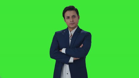 Portrait-of-confident-Indian-journalist-Green-screen