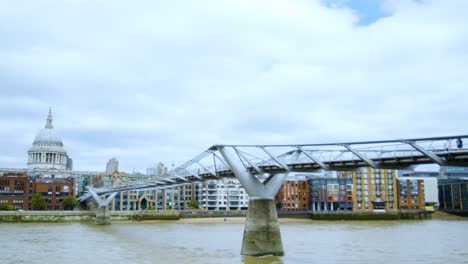 london thames people walking over millennium bridge with st paul's cathedral in the background time-lapse