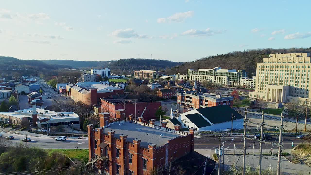 Aerial View of a City Nestled in the Hills