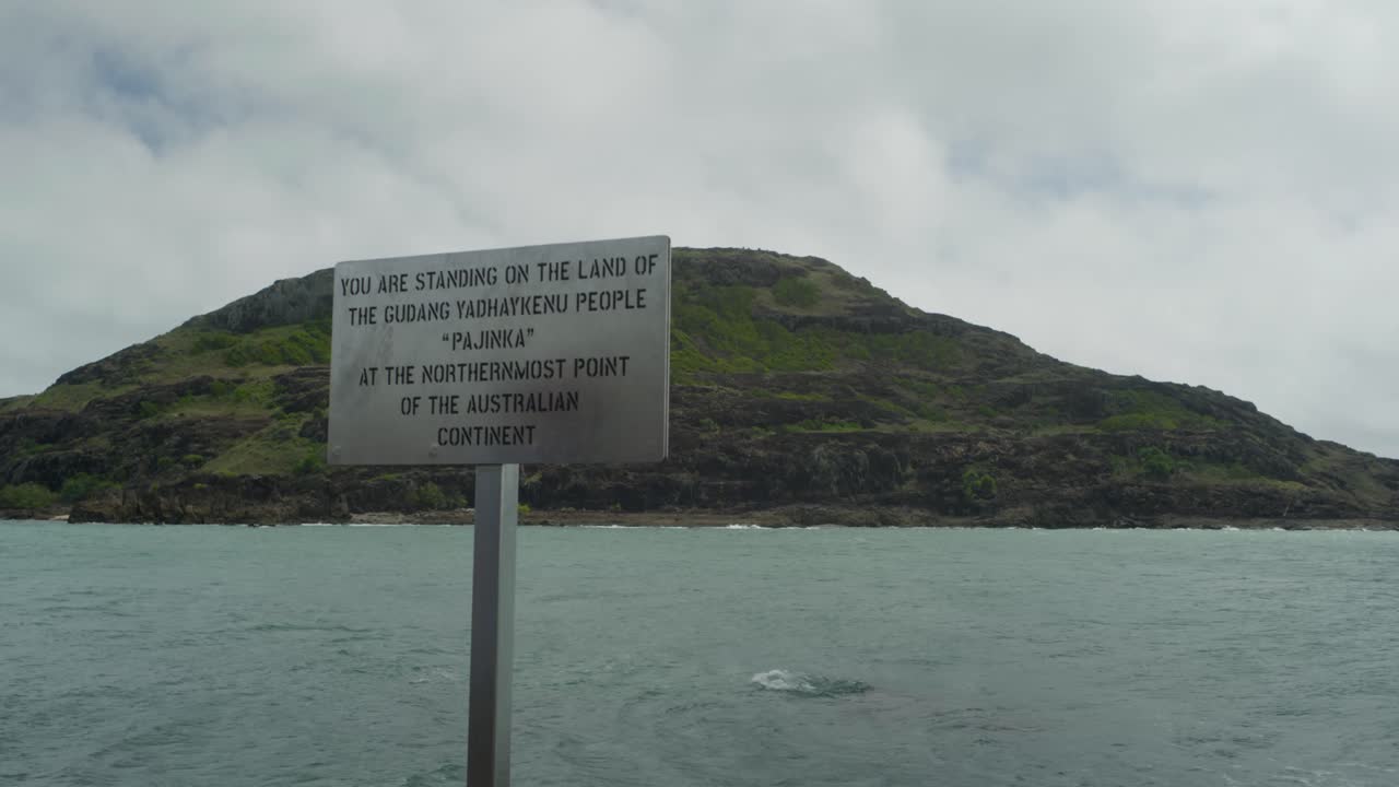The sign at the northernmost point of Australia, known as Pajinka, or The Tip, in Cape York. A man and his son reach the sign. Clip 3