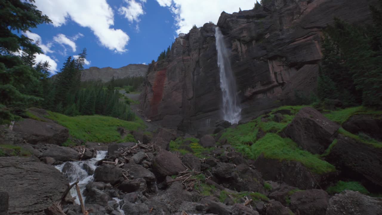 Cloudy shaded Telluride Bridal Veil Falls Waterfall Black Bear Pass Road Colorado landscape static mist spray Ouray Ridgway Box Canyon cliffside hydro power house 4wd hiking blue sky boulders creek