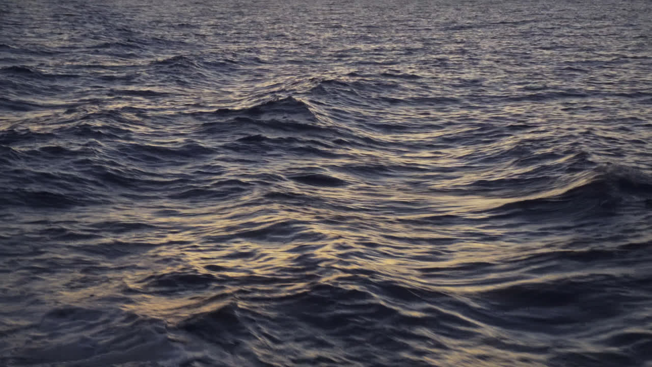 A View Of Relaxing Ocean Waves On Sunset In Summer. POV
