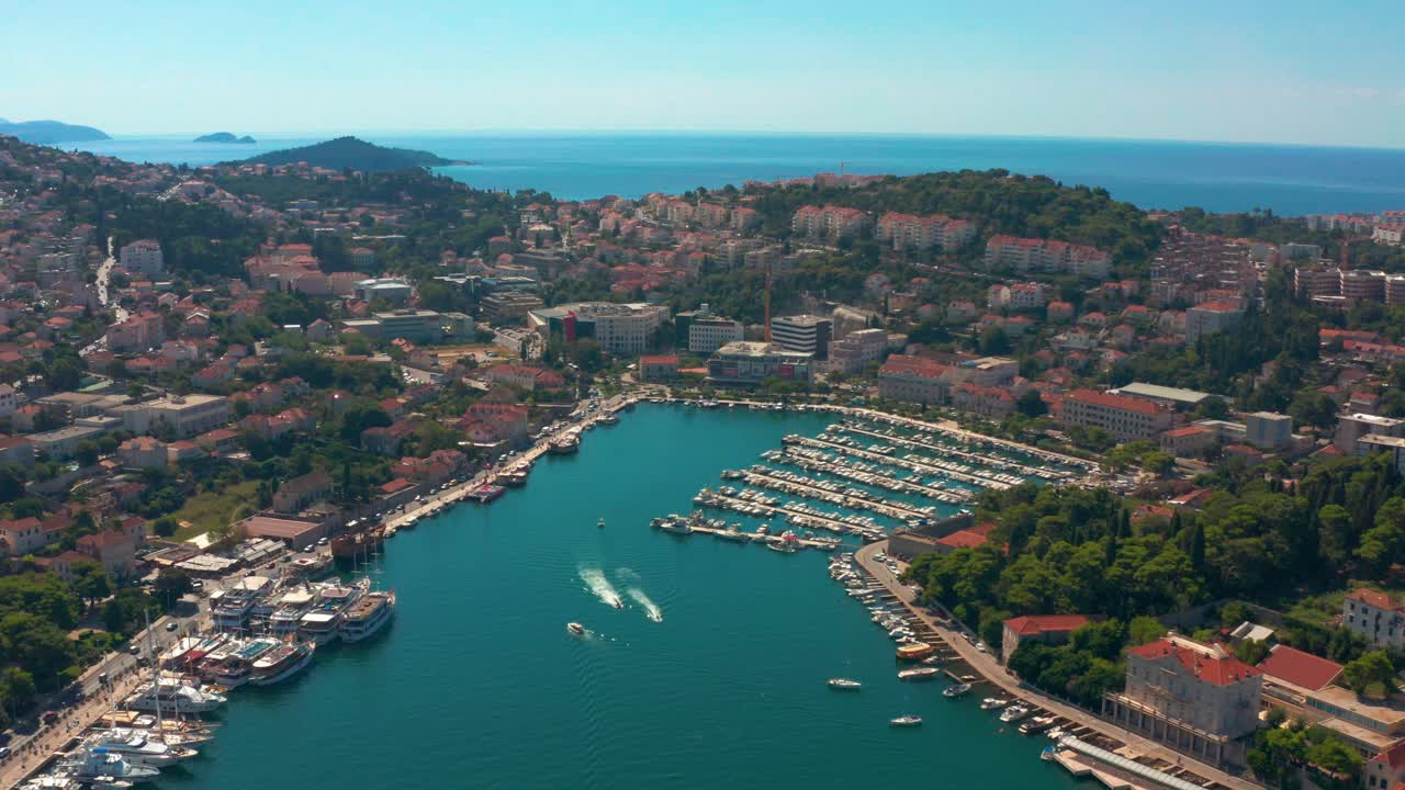 Aerial shot flying over dubrovniks main sailing route towards it's famous port