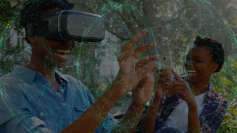 Animation of network of connections over african american woman wearing vr headset in the park
