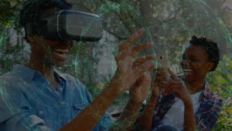 animation of network of connections over african american woman wearing vr headset in the park